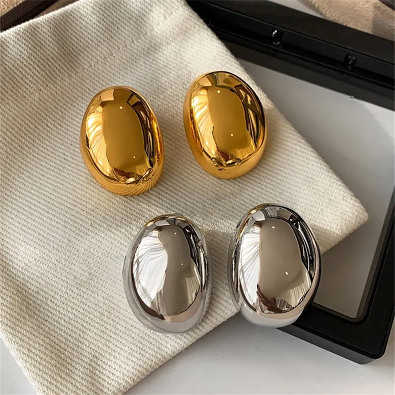 Elegante øreringe i guld og sølv