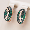 Guldbelagte salamanderøreringe med elegante grønne krystaller
