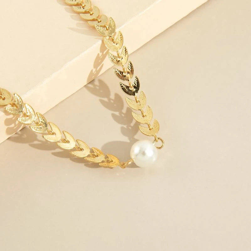 Græsk halskæde med perle i guld