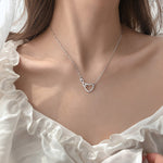 Uendelig kærlighed halskæde med zirkoner i sterling sølv