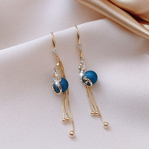Festlige øreringe med blå perler