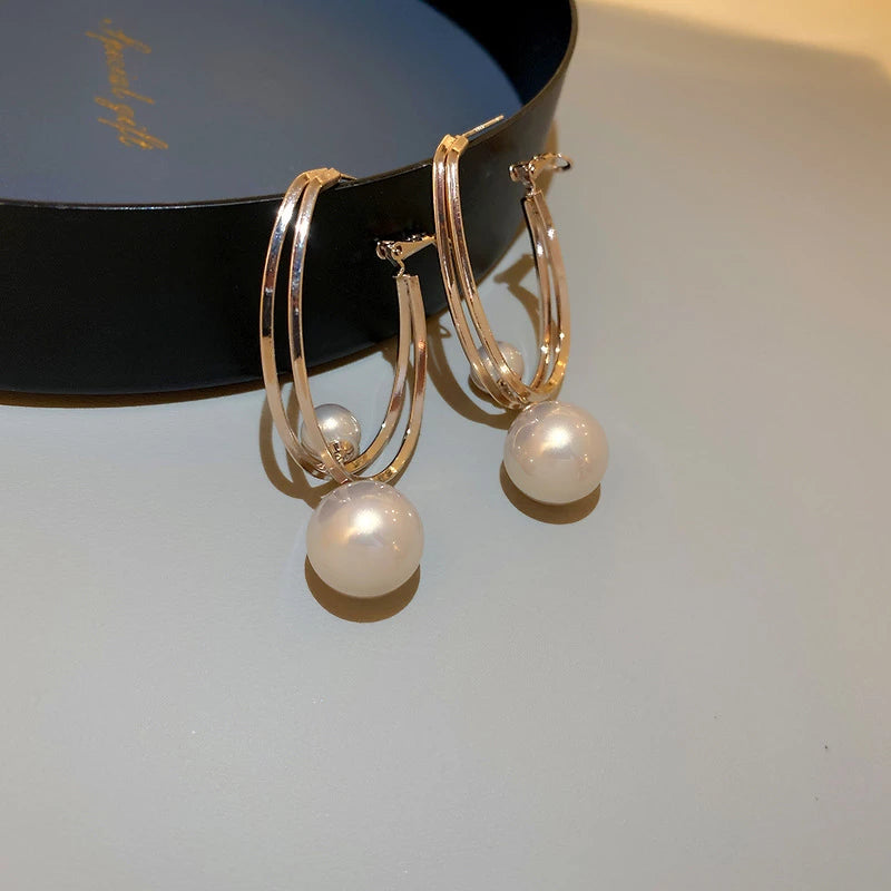 Luksus øreringe med bronzebelagte perler i guld