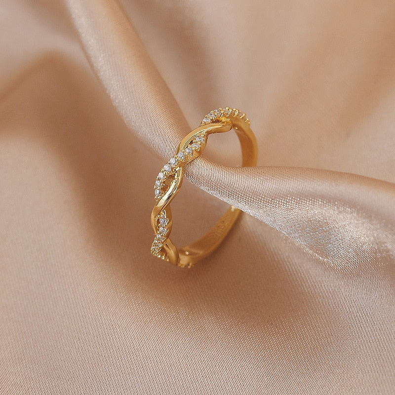 Justerbar ring med zirkonia-blænde i guld