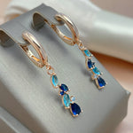 Elegant blå og guld krystal øreringe