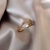Justerbar ring med guld cubic zirconia loop
