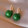 Luksus øreringe med grøn perle i guld
